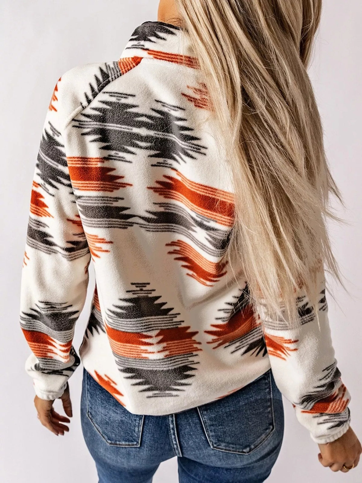 Geometric snap-down jacket side/back view with orange and navy geometric stripe print