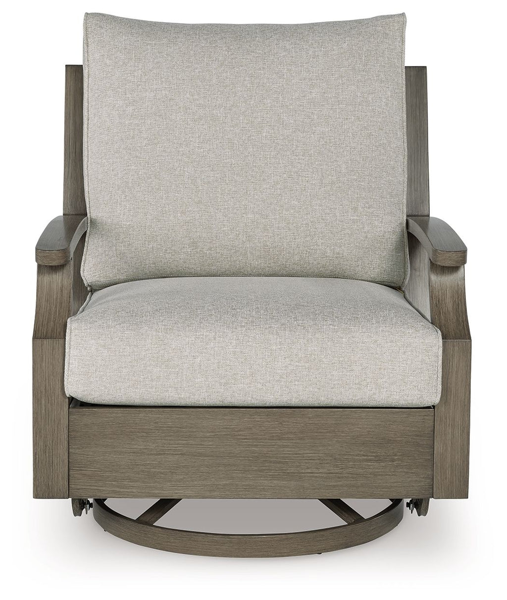 Swivel glider chair with beige cushion and brown frame, front view