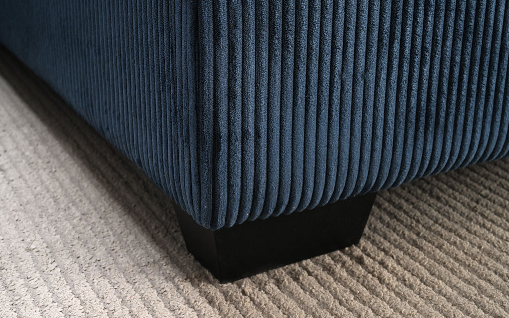 Oversized sectional sofa with chaise, blue ribbed fabric and dark base