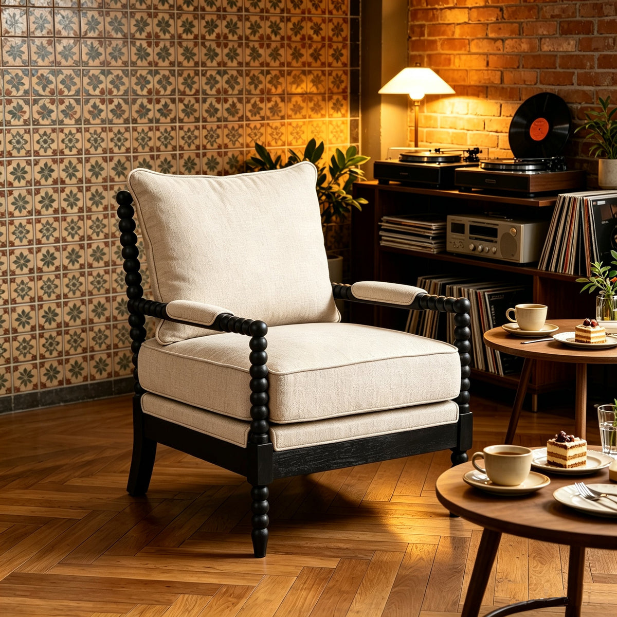 Cream fabric accent chair with padded arms and black beaded wood frame