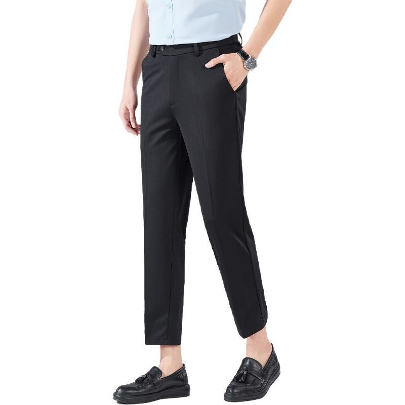 Black tailored trousers, high waist, belt loops, and straight tapered leg