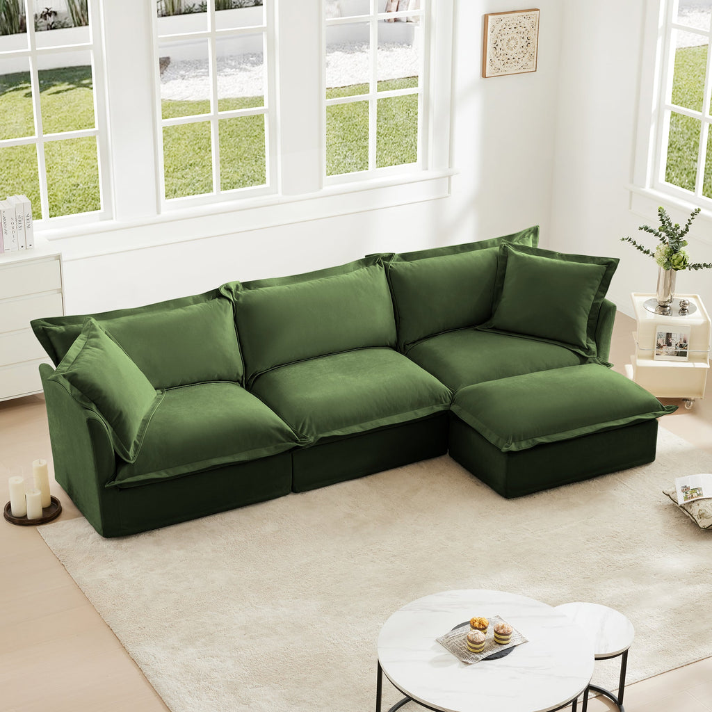 Green L-shaped slipcovered sectional sofa with cushioned seats, back pillows, and chaise