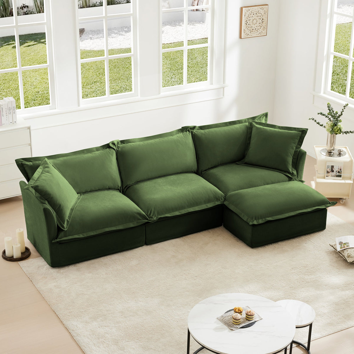 Green L-shaped slipcovered sectional sofa with cushioned seats, back pillows, and chaise