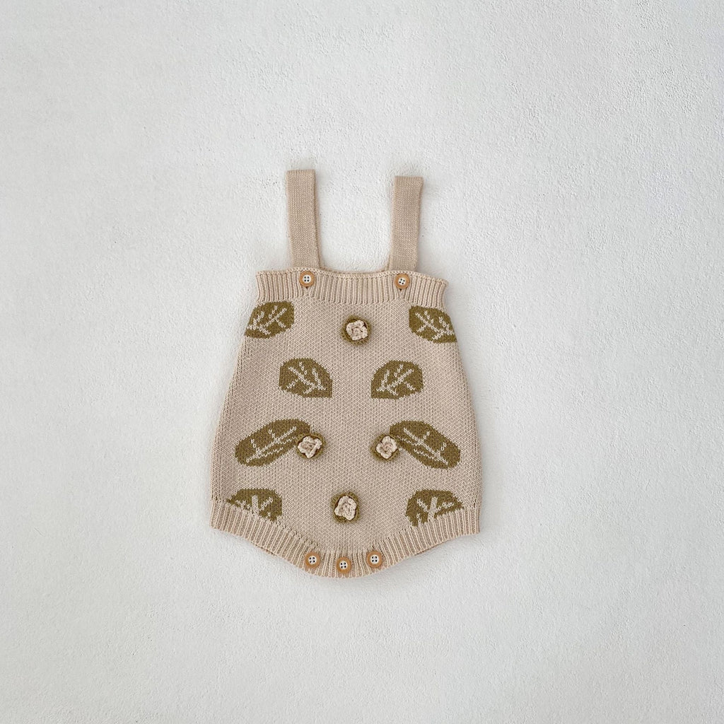 Cream leaf-jacquard suspender skirt with button accents and green leaf pattern