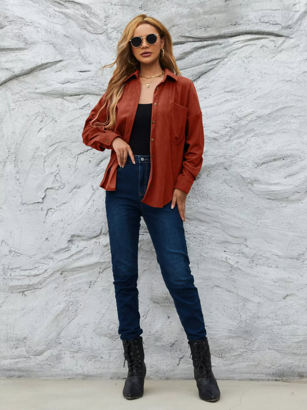 Rust corduroy button-up shirt with button front and long sleeves