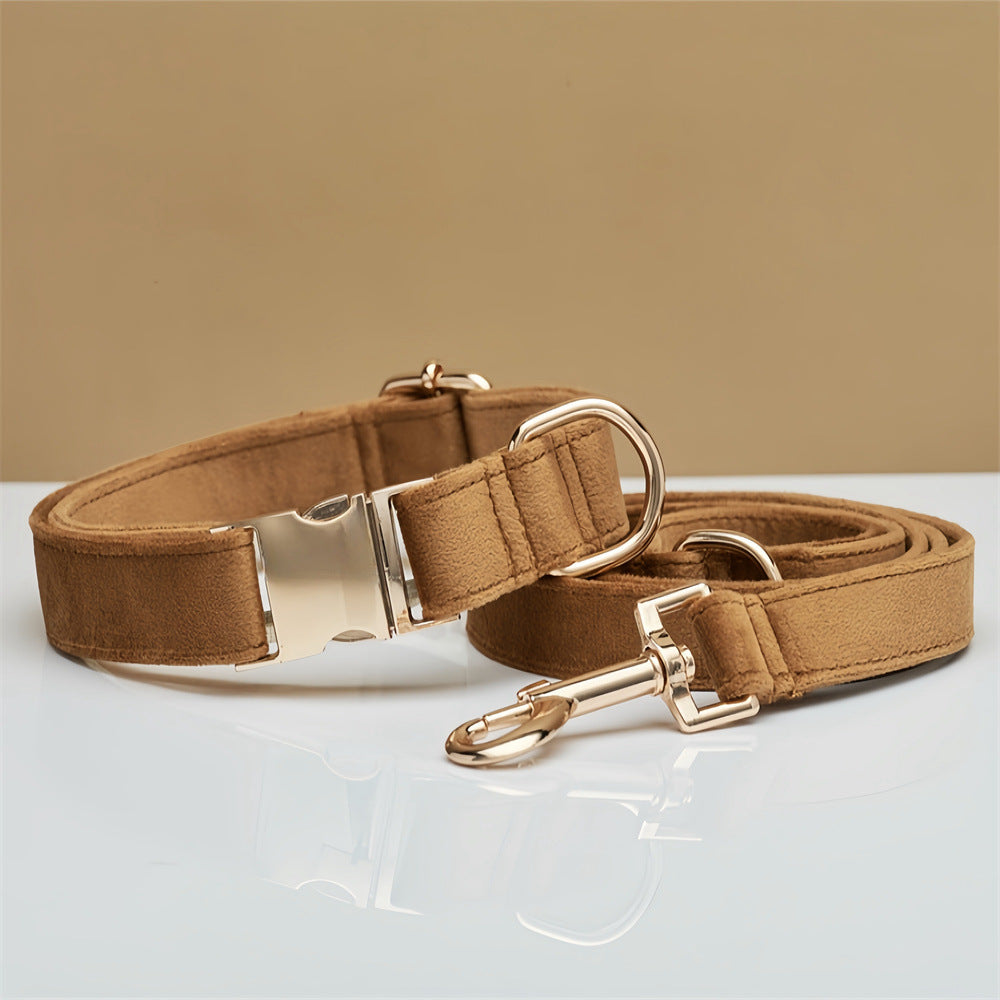 Brown velvet dog collar and matching leash with gold-tone hardware, flat lay