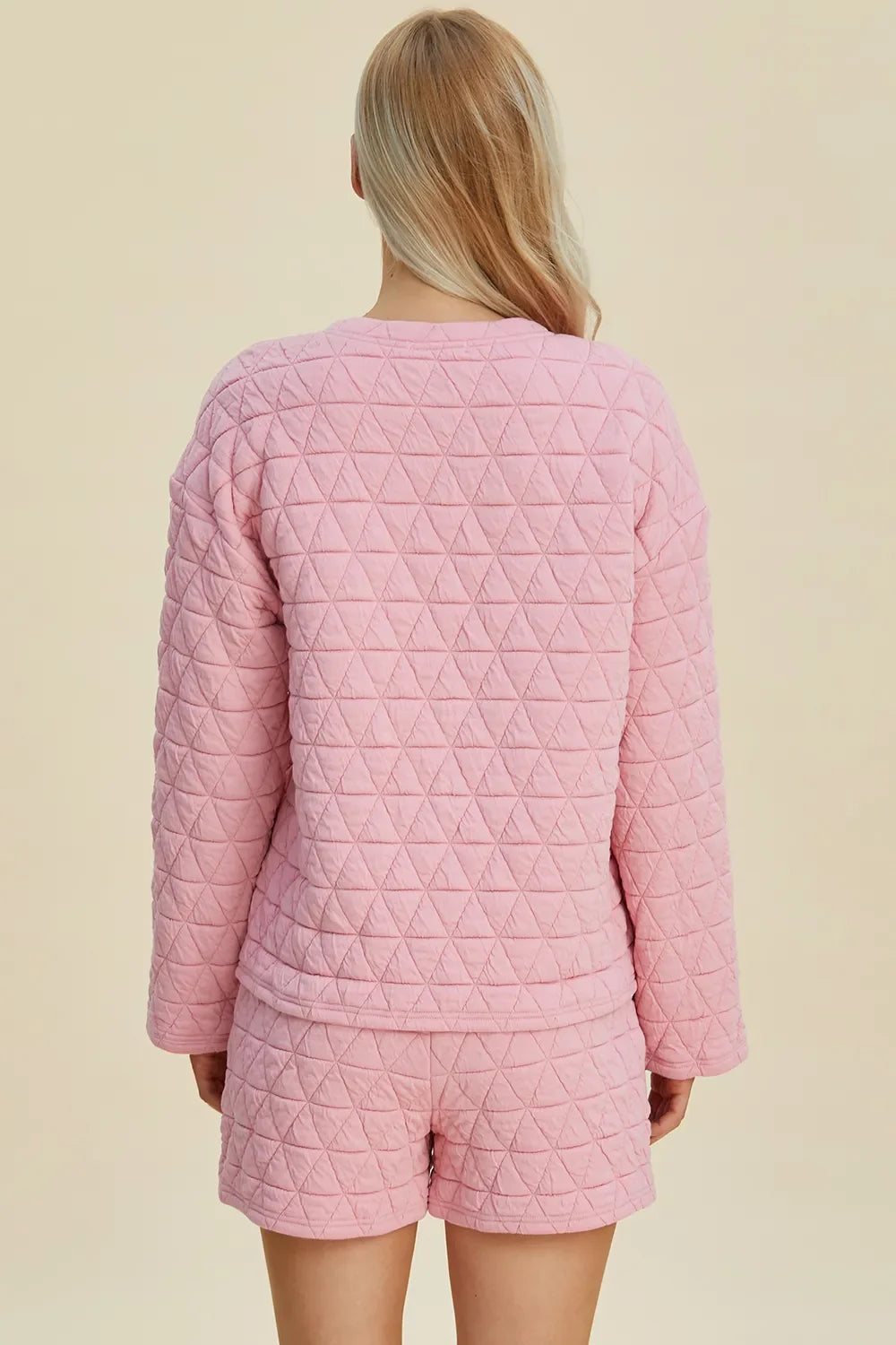 Pink textured long-sleeve top and shorts set, back view