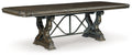 Dark brown dining extension table with ornate pedestal-style legs and X-frame support