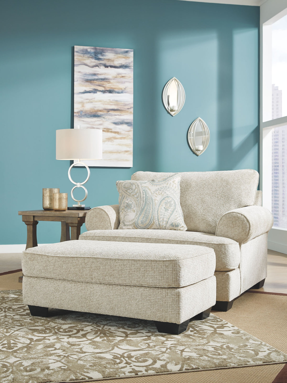 Sandstone upholstered chair with patterned throw pillow and thick padded seat