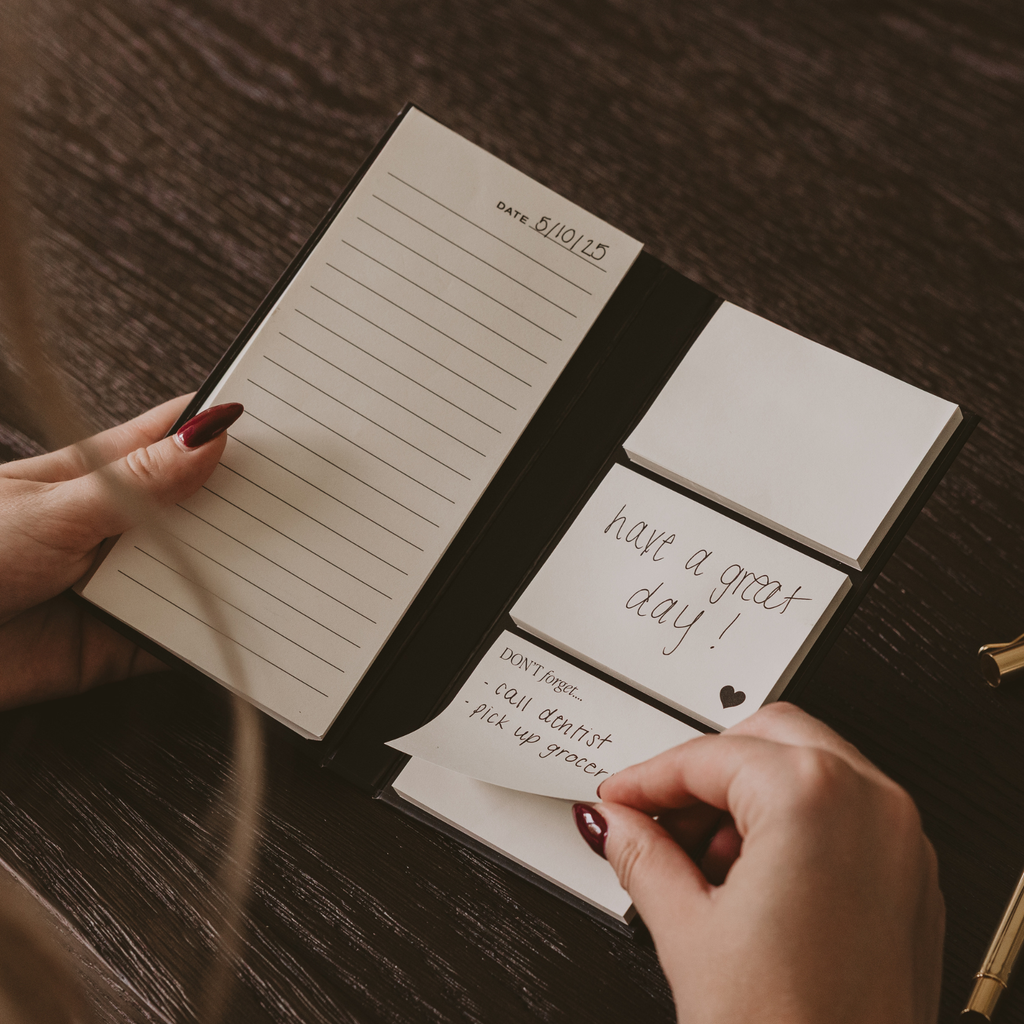 Portable sticky notes booklet with ruled pages and stacked note tabs reading “have a great day.”