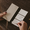 Portable sticky notes booklet with ruled pages and stacked note tabs reading “have a great day.”