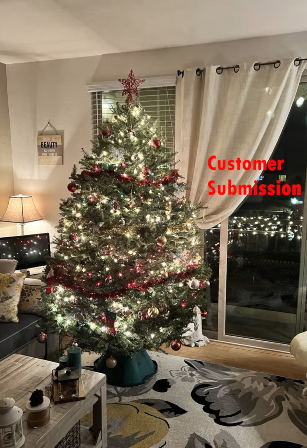 Decorated balsam fir Christmas tree indoors with red ornaments and warm white lights