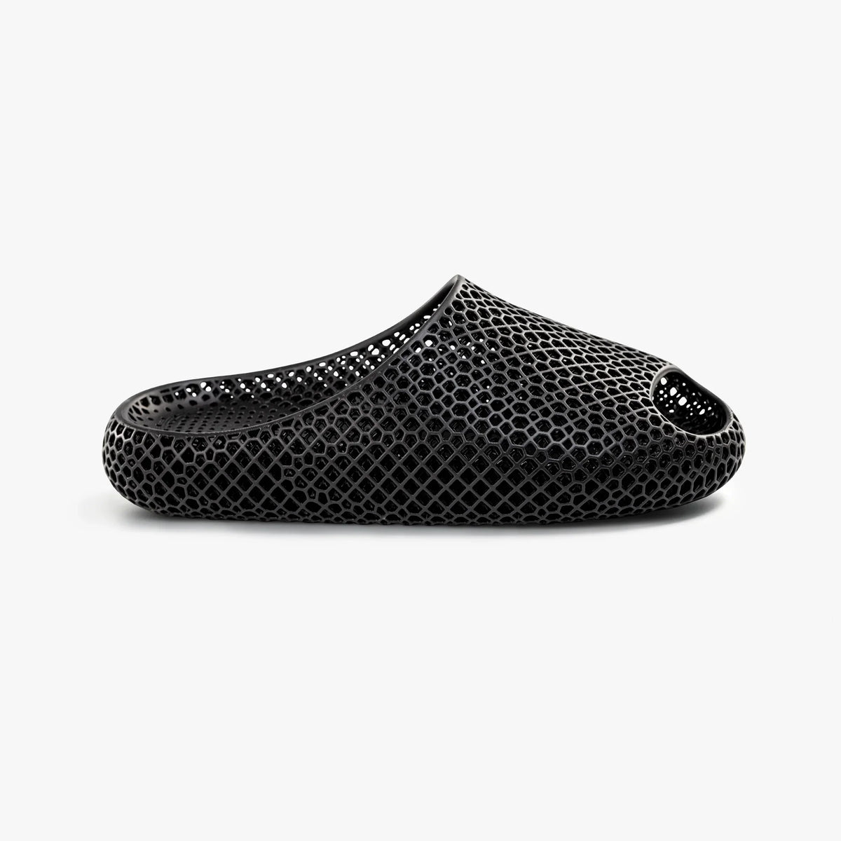 Black 3D-printed mesh slip-on slippers with rounded toe and cushioned sole.