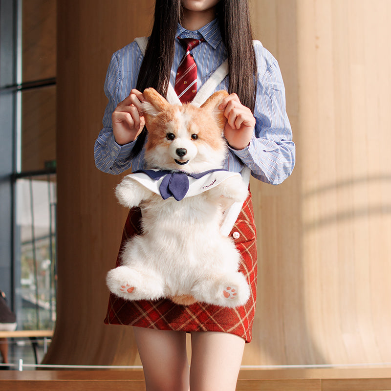 Plush corgi backpack with brown-and-white fur, blue bow, and front pocket pouch