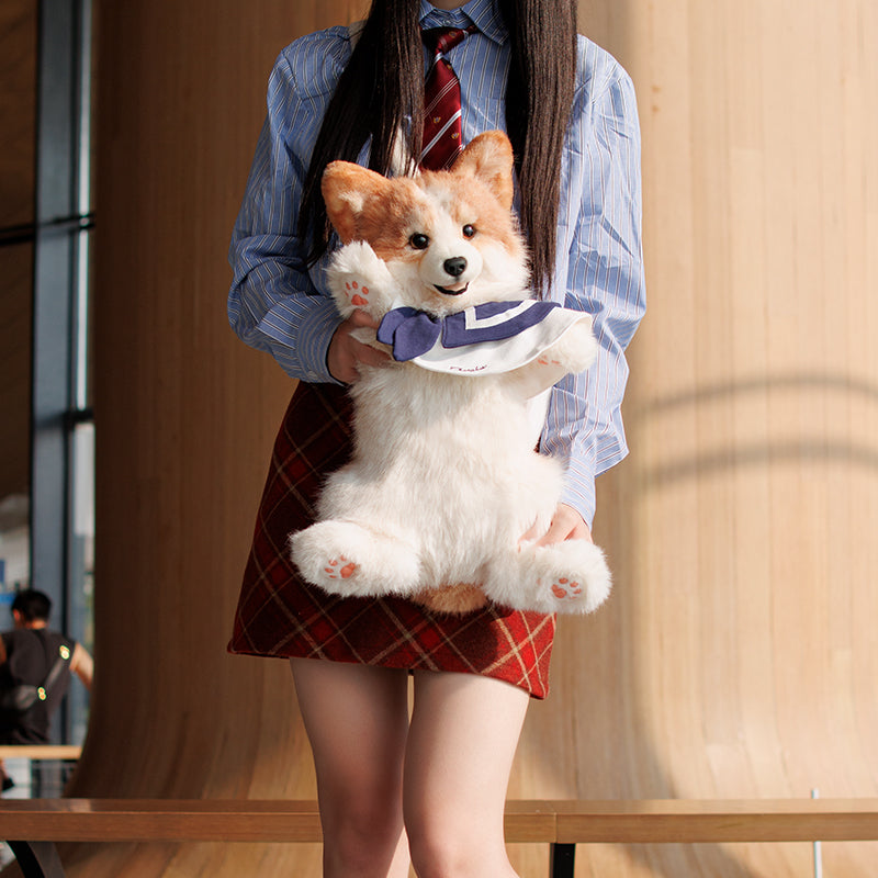 Corgi plush backpack with plush corgi face, navy bow, and adjustable shoulder straps