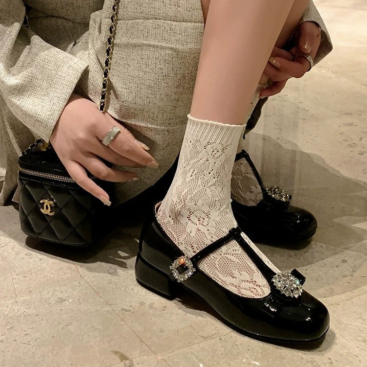Women’s black Mary Jane single shoe with rhinestone bow buckle detail and chunky heel