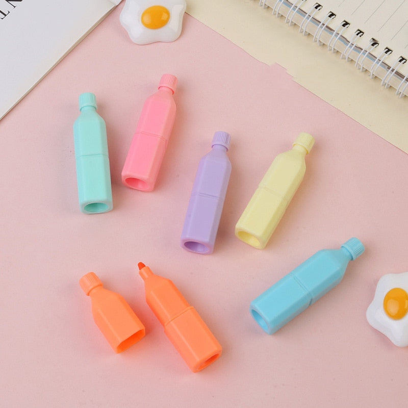 Pastel capsule highlighters in turquoise, pink, purple, yellow, orange, and blue.