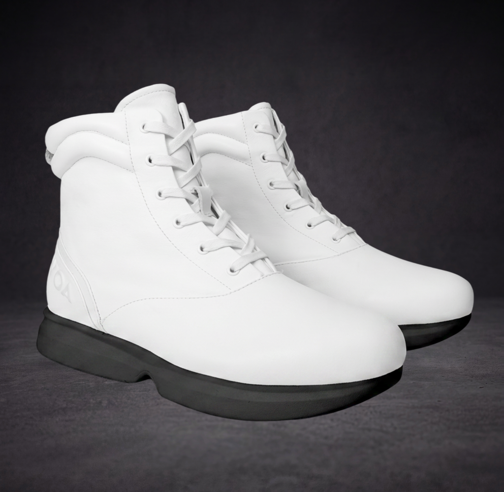 White WOA boot pair, lace-up high-top style with black cushioned outsole