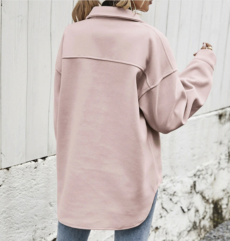 Women’s single-breasted lapel coat in dusty pink, back view with yoke seam