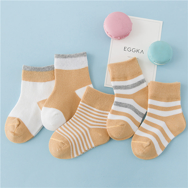 Children's winter cotton striped socks in mustard, white, and gray with ribbed cuffs