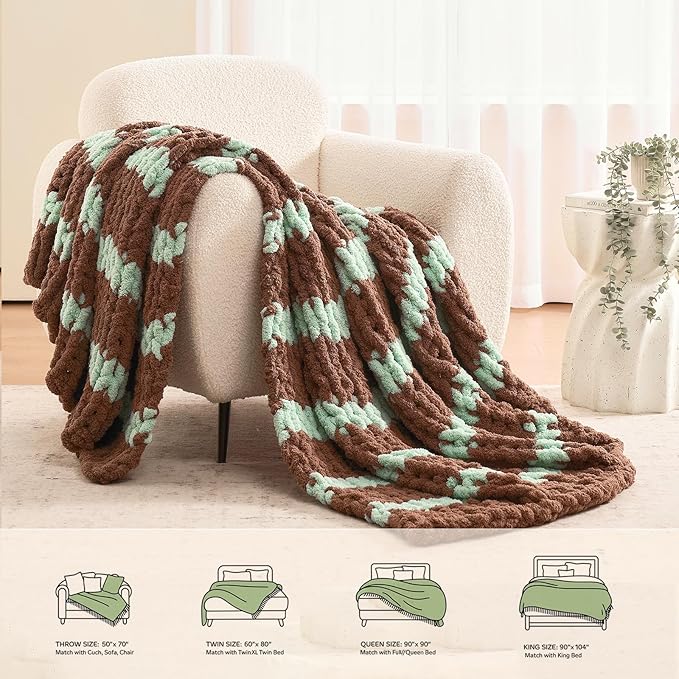 Draped brown and mint chunky chenille knit blanket with cable stripe pattern