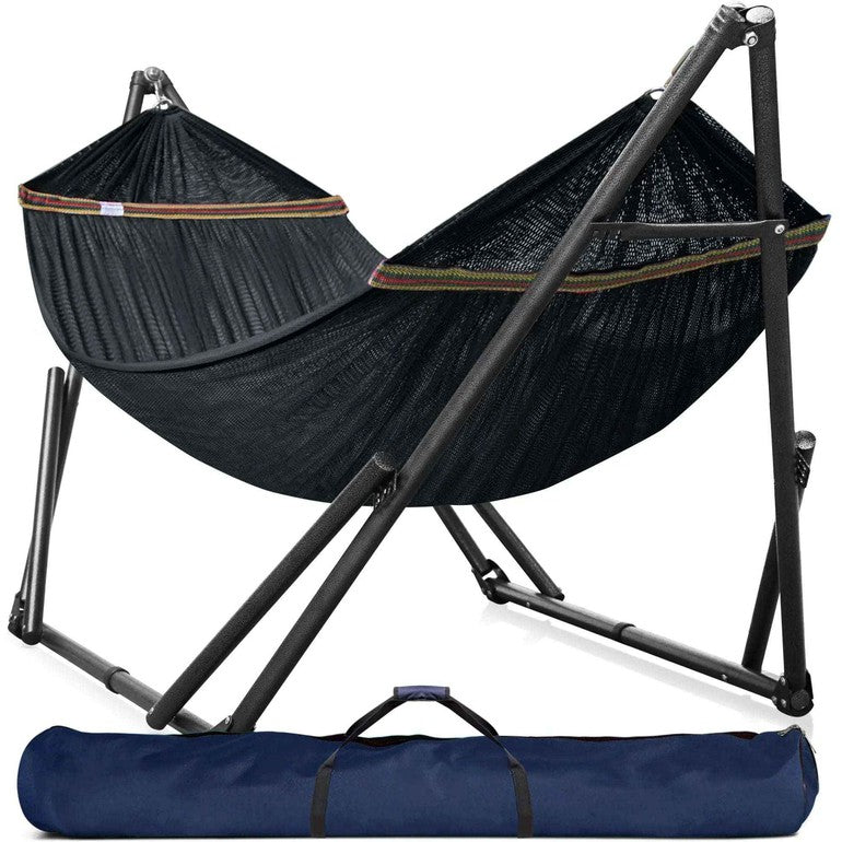 Black hammock on a metal stand with fabric ends and carrying bag