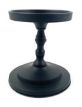 Matte black pillar candle holder with wide round base and fluted stem