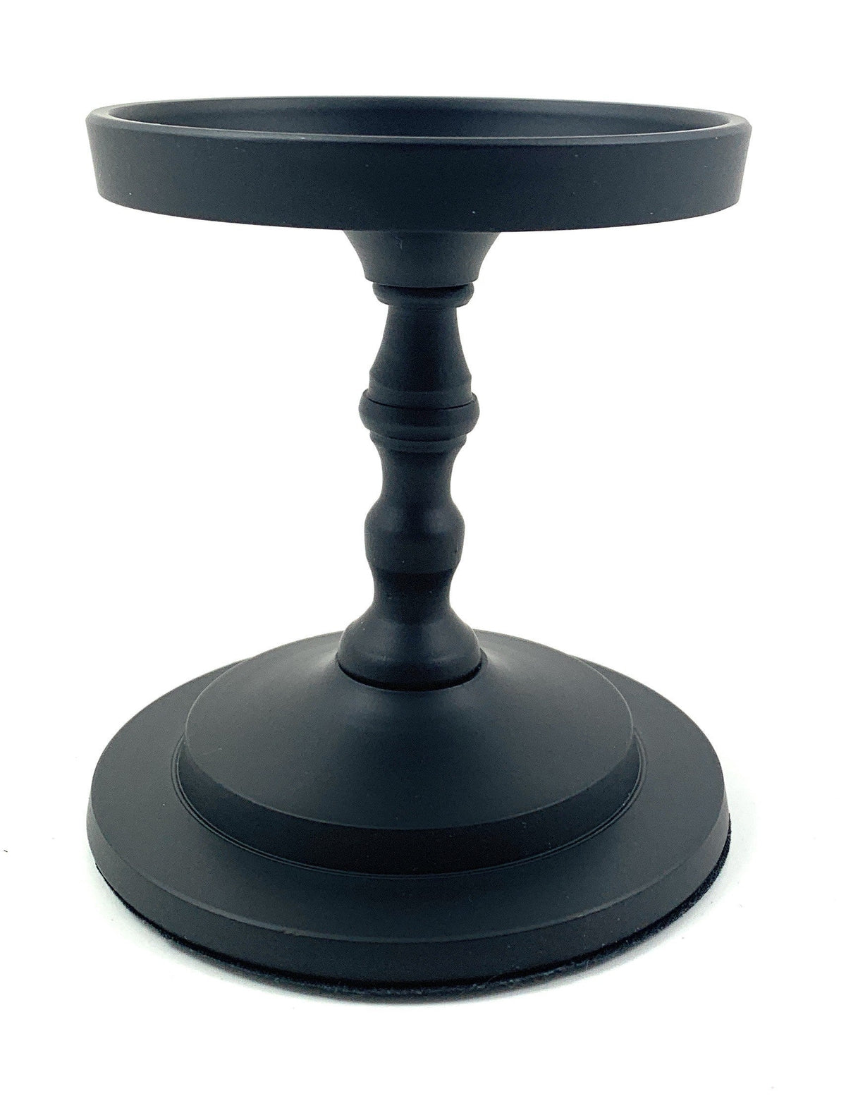 Matte black pillar candle holder with wide round base and fluted stem