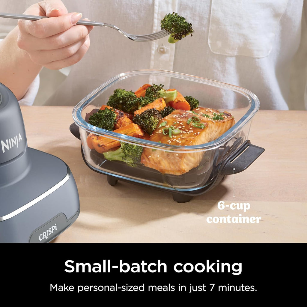 6-cup clear glass air fryer container on portable base with roasted food inside