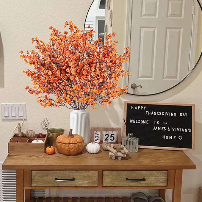 Orange artificial baby's breath bouquet in ribbed white vase