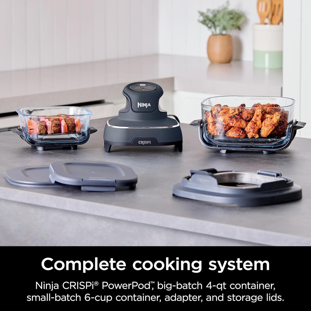 Ninja Crispi PowerPod portable air fryer with two clear glass TempWare containers and food