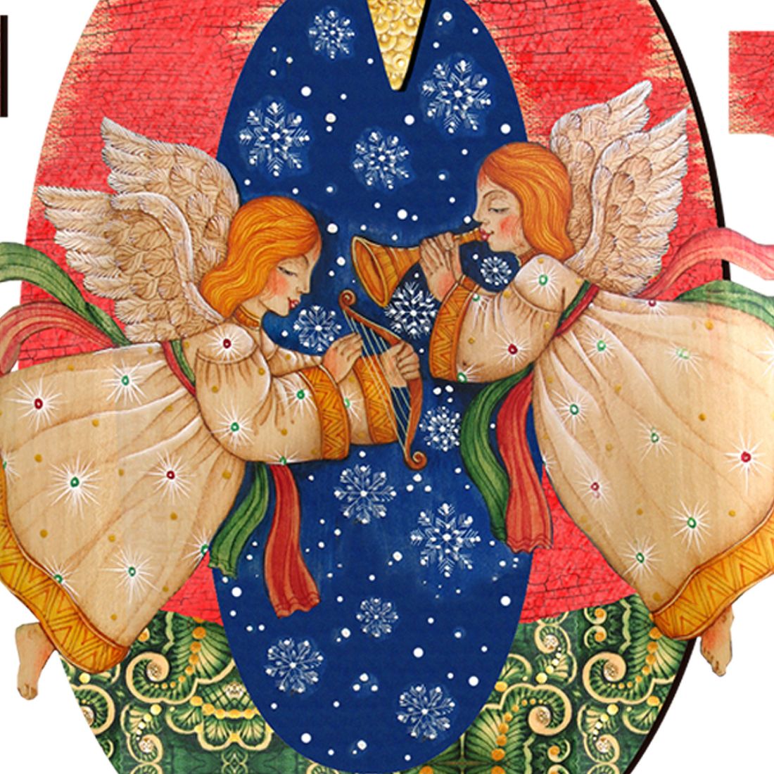 Nativity angel detail on blue dress with white snowflake patterns beneath a yellow star.