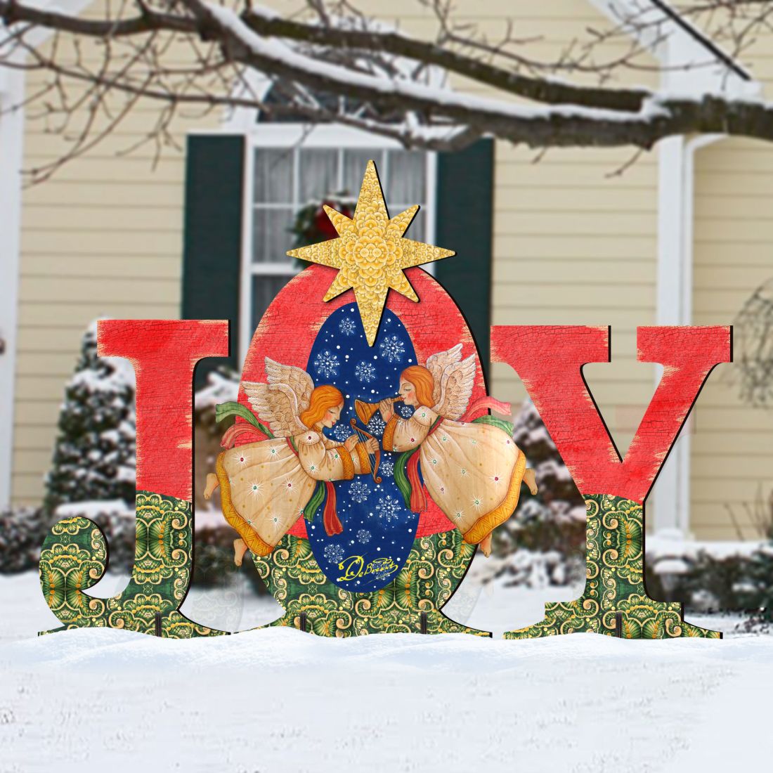 Outdoor “JOY” nativity yard decor featuring angels under a yellow star on red letters.