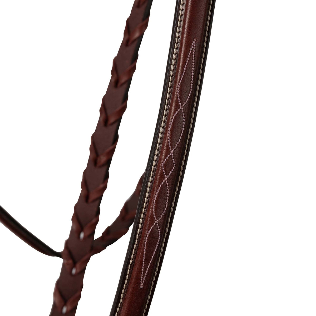 Brown leather reins close-up with stitched detailing and laced braided sections