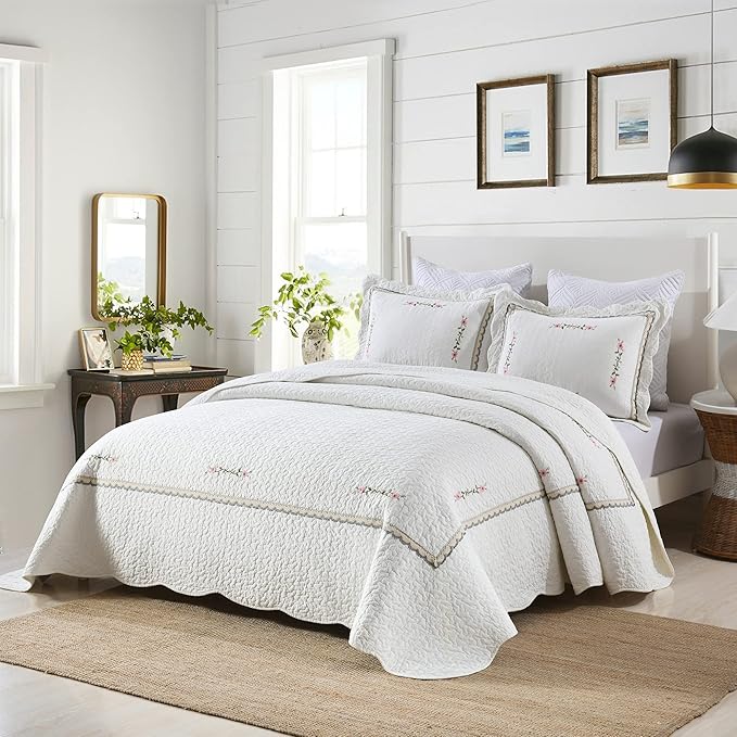 White quilt coverlet bedding set with embroidered pillow shams and stitched border