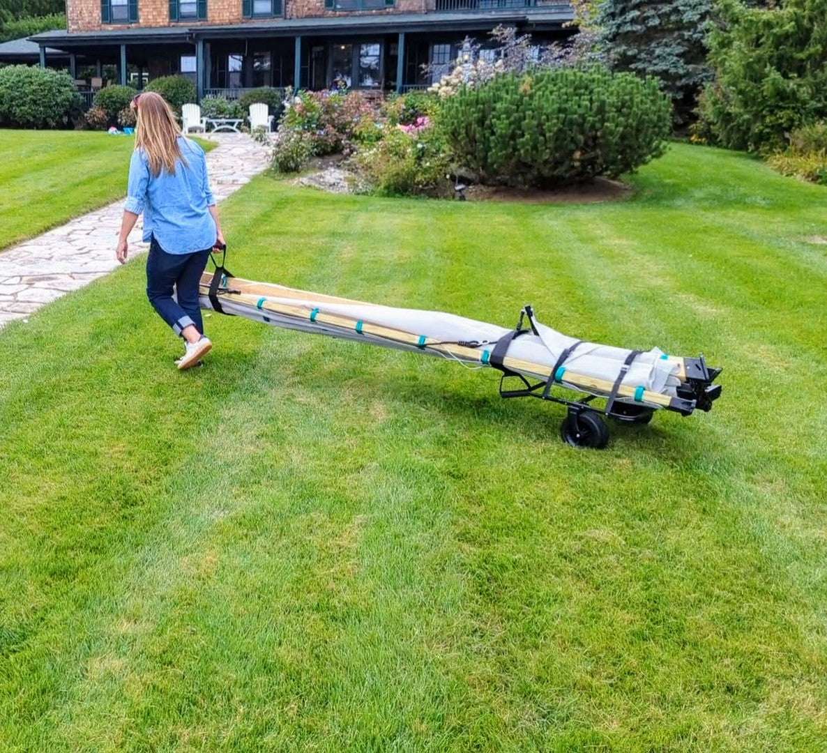 Lawn roller cart with long roller drum, two wheels, and handle