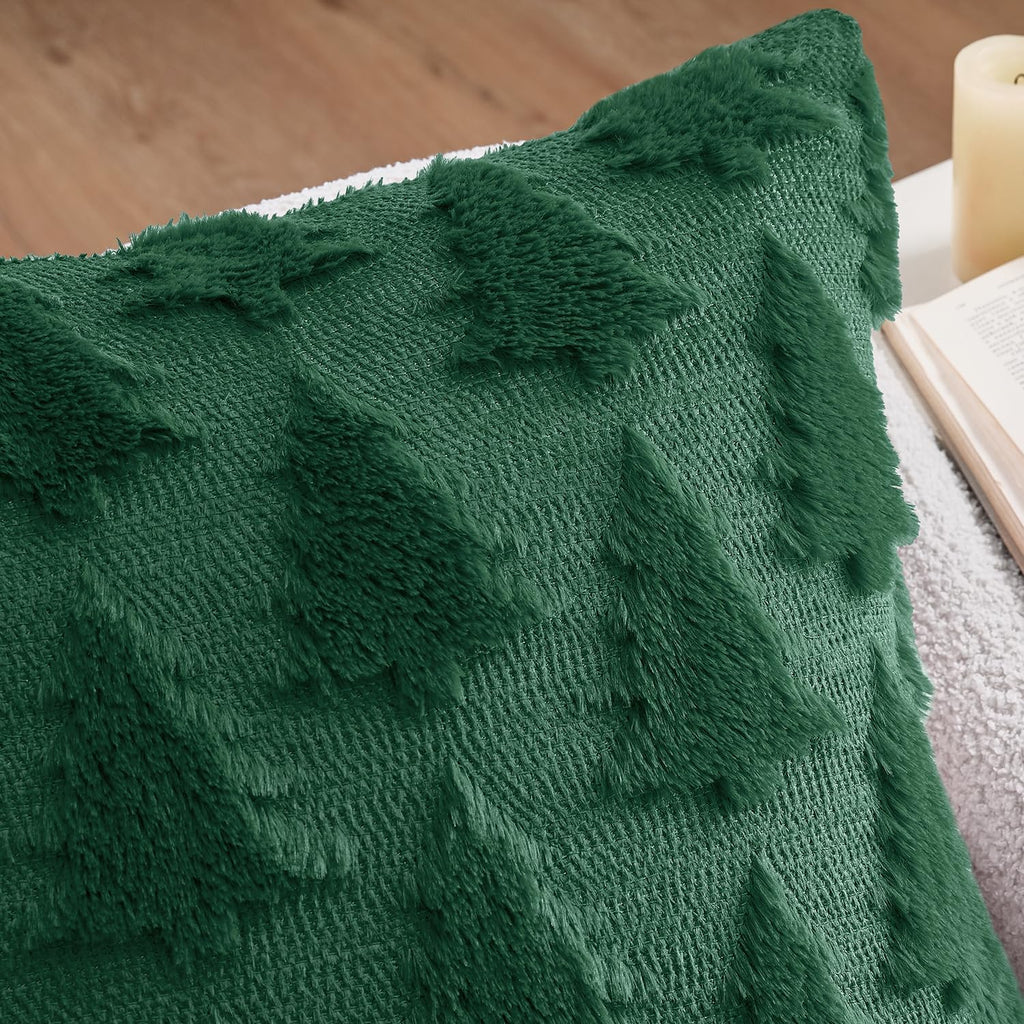Close-up dark green plush faux wool pillow cover with raised tree pattern texture