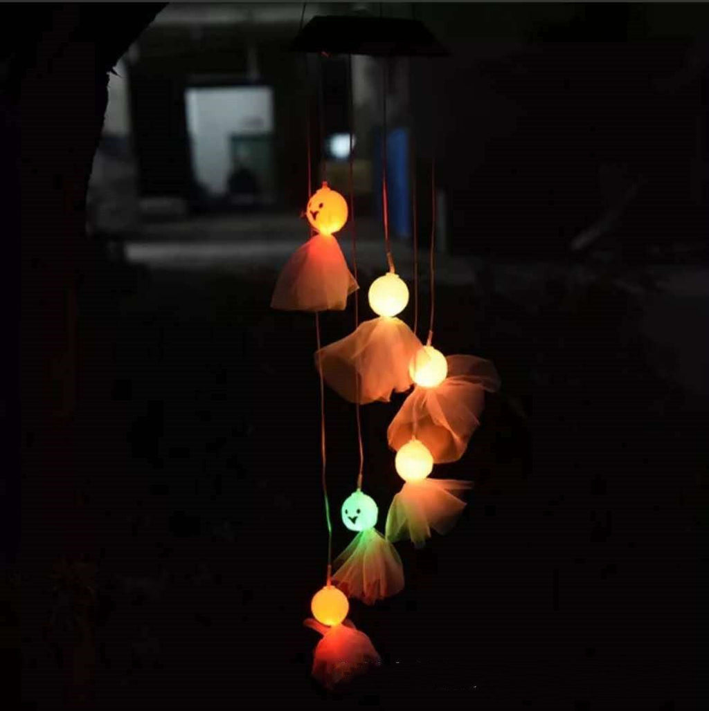Solar LED wind chime with glowing pumpkin-like hanging light shades