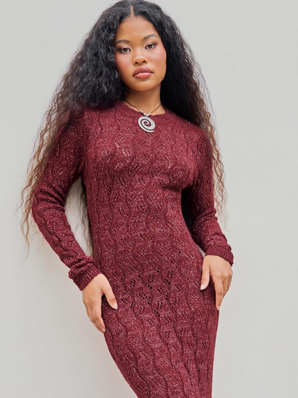 Burgundy long-sleeve crewneck maxi sweater dress with textured knit pattern, front view.