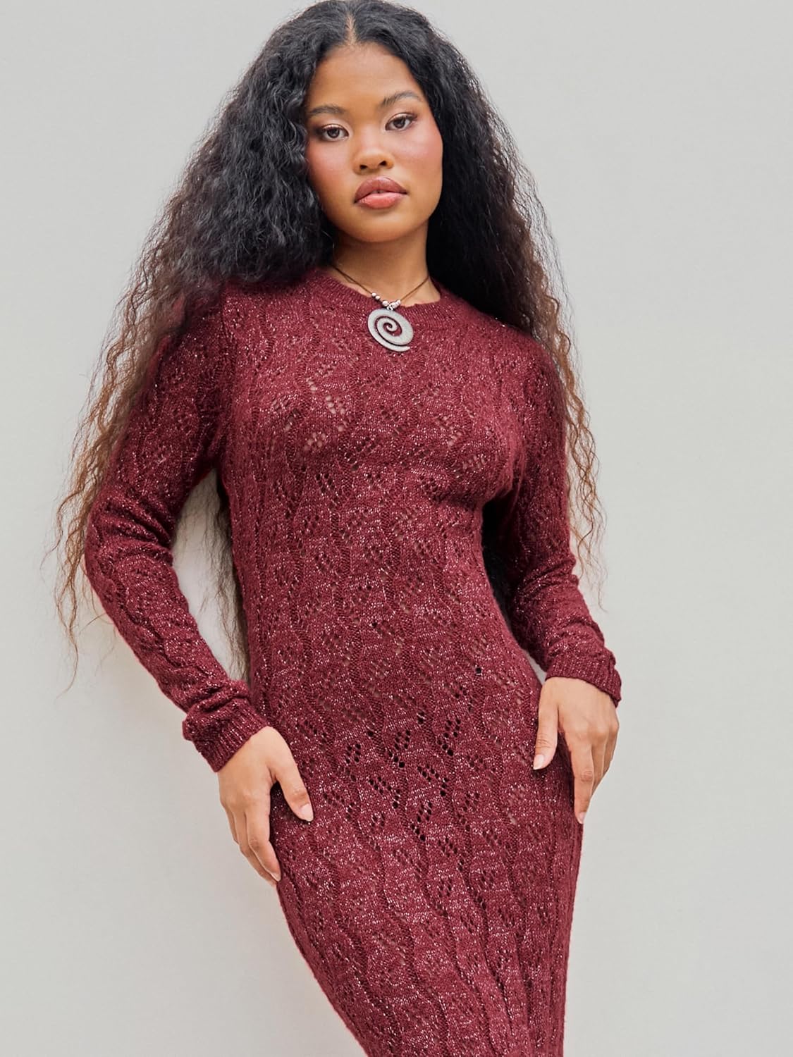 Burgundy long-sleeve crewneck maxi sweater dress with textured knit pattern, front view.