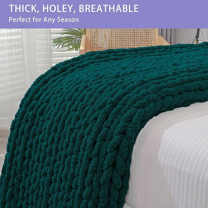 Dark green chunky knit throw blanket showing thick rope-knot cable stitch texture