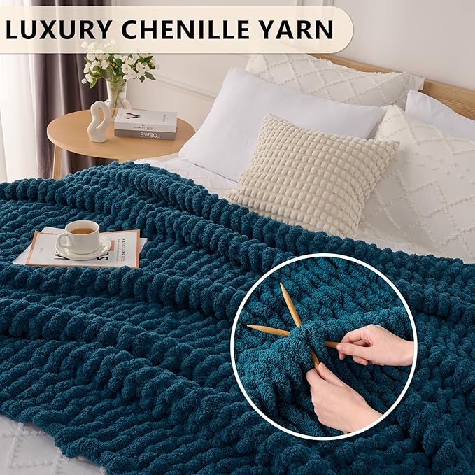 Chunky chenille throw blanket, deep blue textured knit, laid across sofa