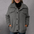 Grey fleece button-up coat with lapels, front pockets, and dark buttons