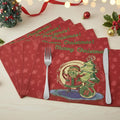 Set of four red Christmas tapestry placemats with Merry Christmas and Santa artwork
