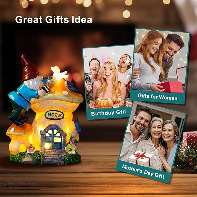 Solar gnome lantern statue with glowing house, with gift photo cards nearby