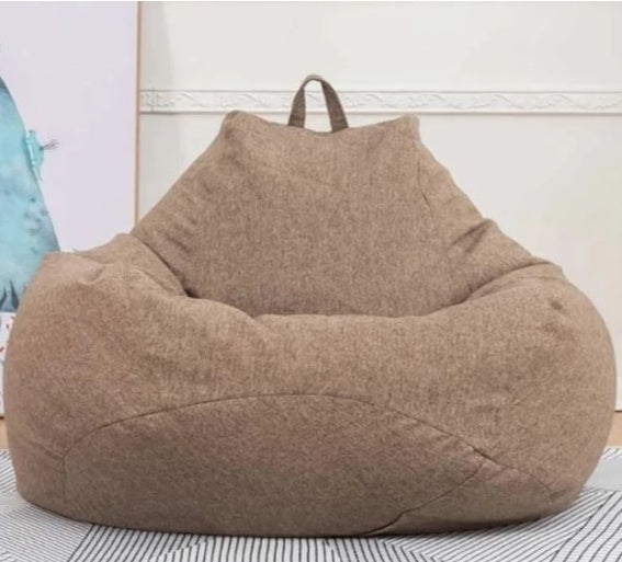 Brown giant bean bag chair with carry handle and rounded seat