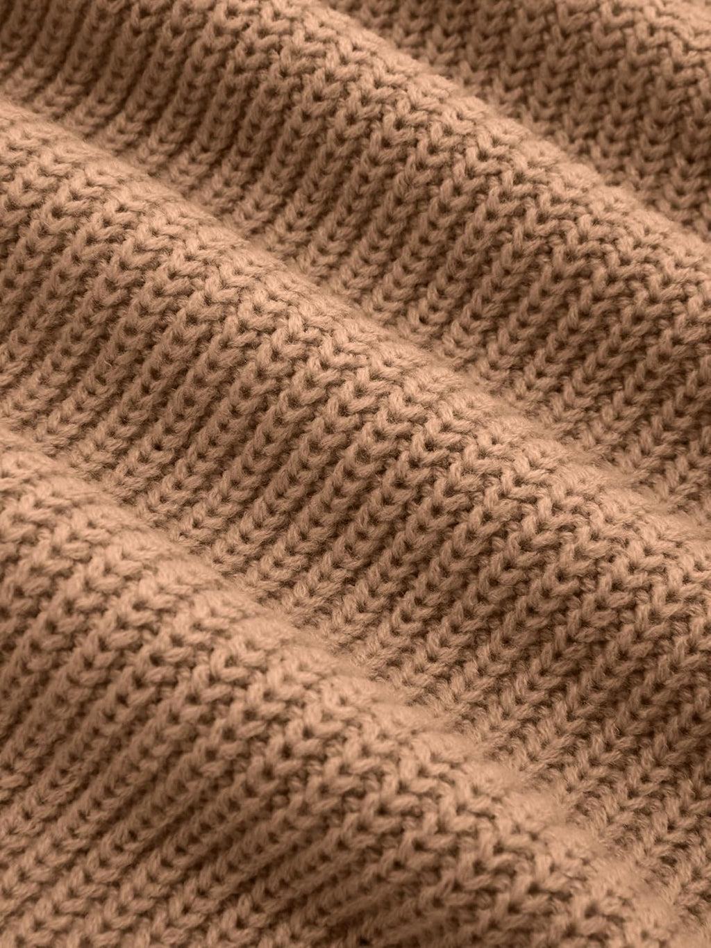 Tan ribbed knit fabric texture close-up, chunky stitch pattern