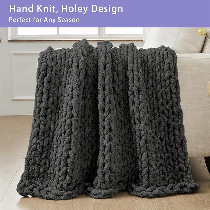 Dark grey chunky knit throw blanket with thick rope cable stitch, full view