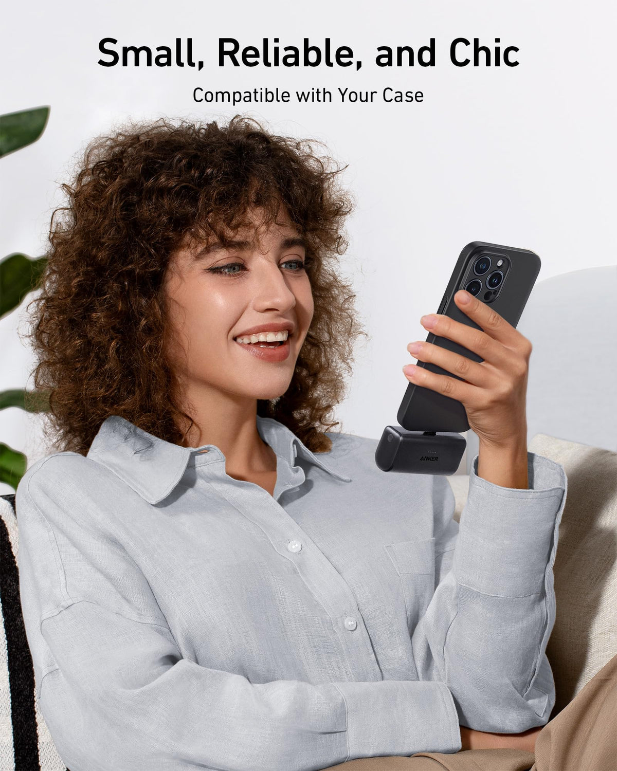 Black Anker nano power bank on phone stand