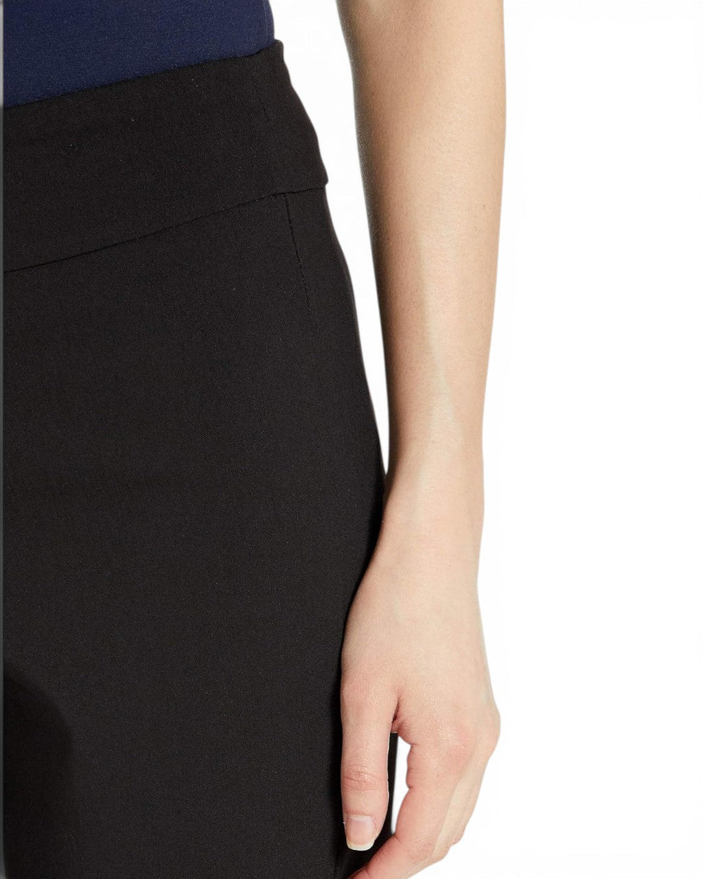 Black pull-on capri pants side seam close-up with elastic waist detail